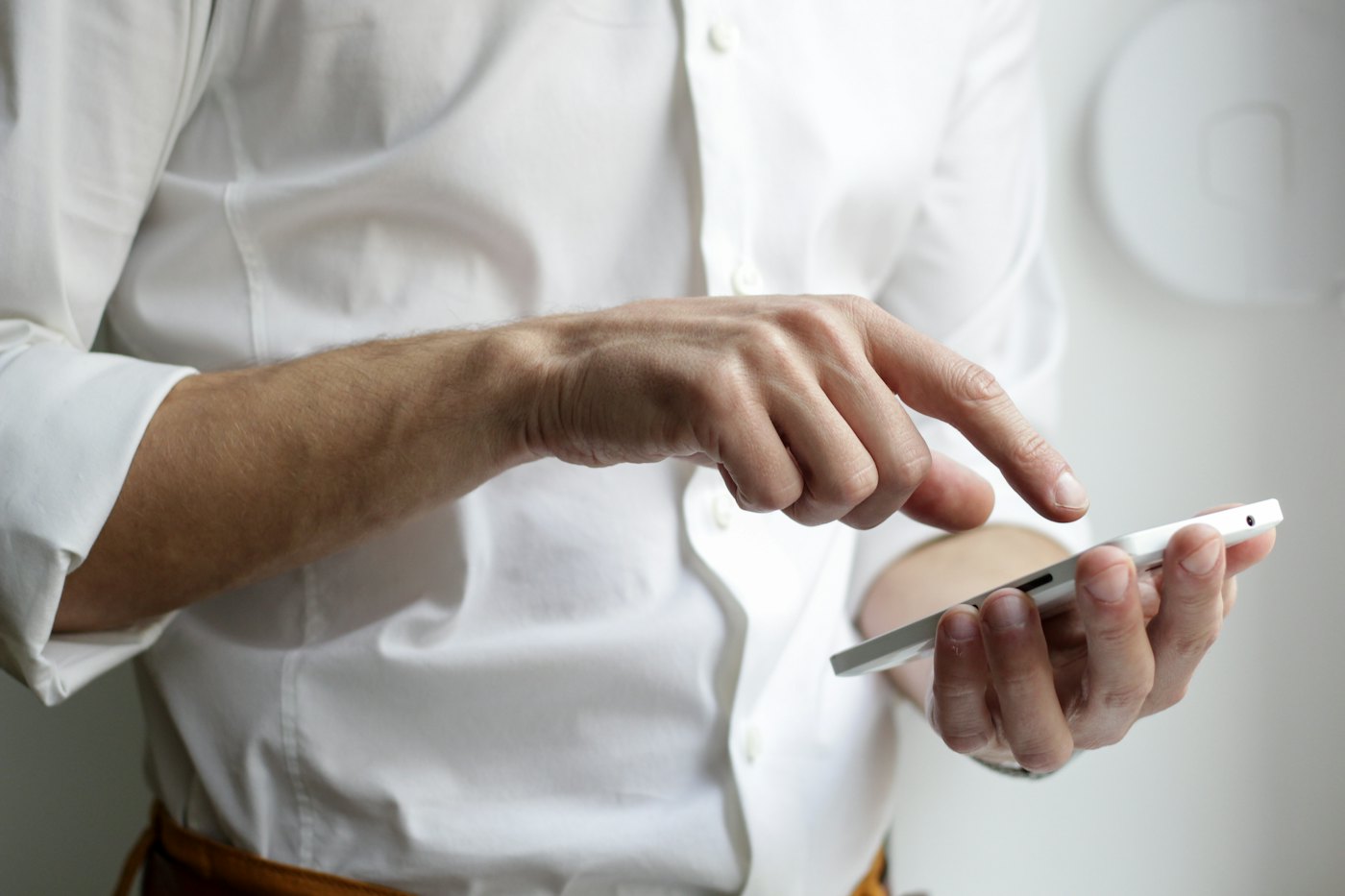 Person using a smartphone to read a news application
