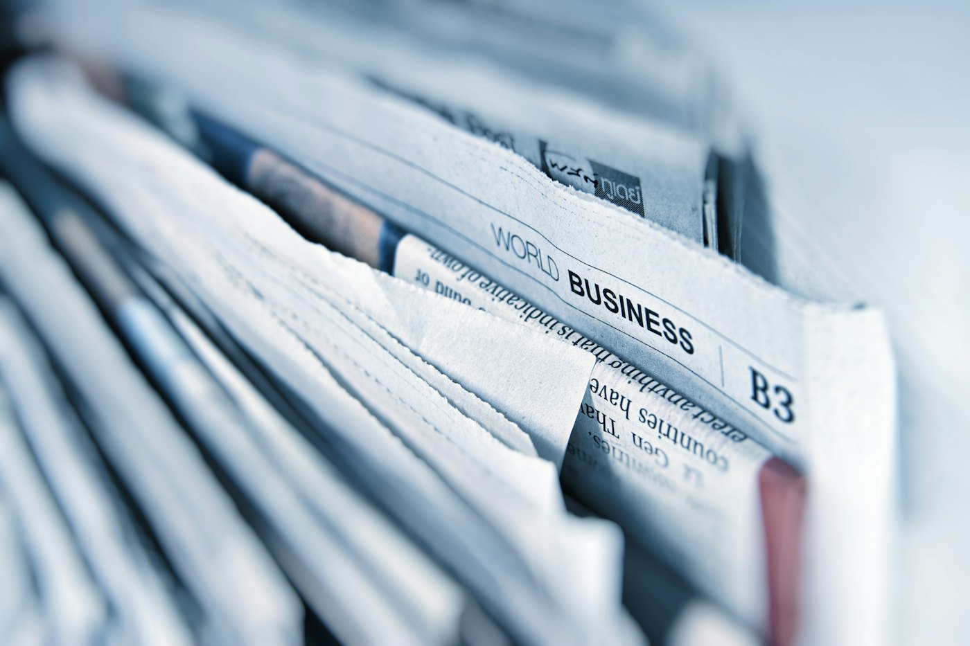 A stack of freshly printed Odia newspapers ready for digital conversion